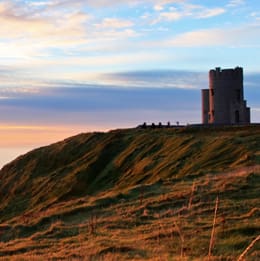 A large tower on top of a hill.