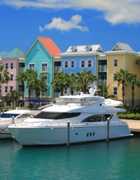 A white boat is docked in the water.