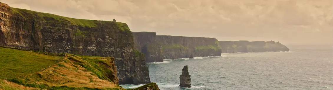 A view of cliffs and the ocean from above.