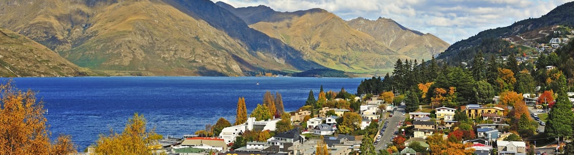 A view of the mountains and houses in the foreground.