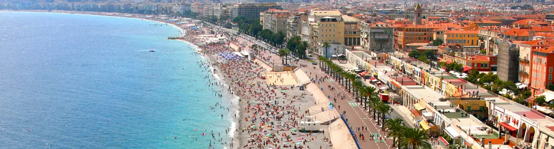 A crowded beach with many people on it