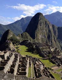 A view of the mountains and buildings in machu picchu.