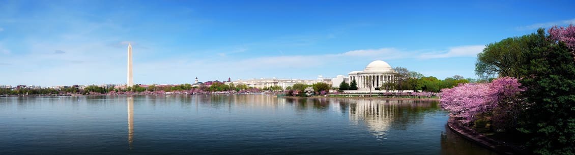 A body of water with buildings in the background.