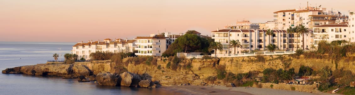 Coastal apartments at sunset.