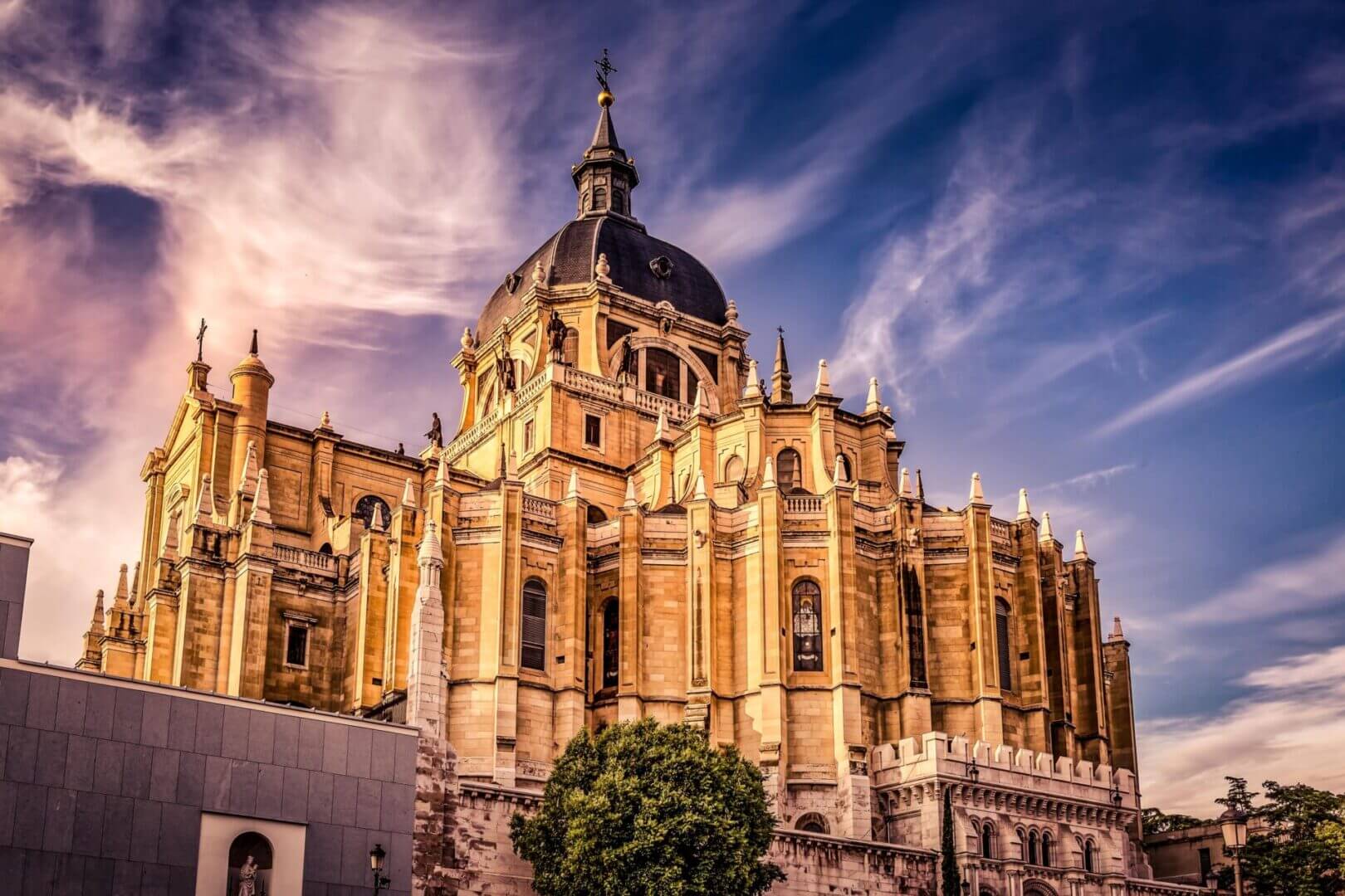 Majestic cathedral under a vibrant, cloudy sky.